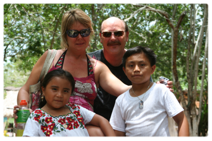 Tourists with some kids from Samula cenote in the town of Dzitnup